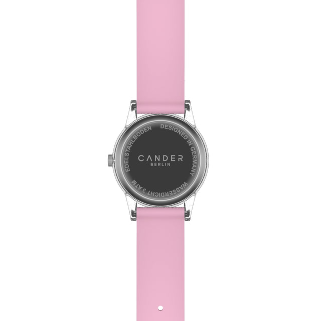 Eine Kinder-Armbanduhr mit einem rosa Glitzerarmband, transparentem Gehäuse und kleinen Schmucksteinen auf dem Ziffernblatt. Die weißen Zahlen auf dem rosa Ziffernblatt sind sehr gut ablesbar.