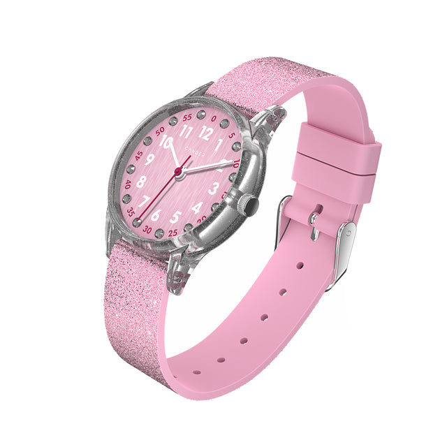 Eine Kinder-Armbanduhr mit einem rosa Glitzerarmband, transparentem Gehäuse und kleinen Schmucksteinen auf dem Ziffernblatt. Die weißen Zahlen auf dem rosa Ziffernblatt sind sehr gut ablesbar.